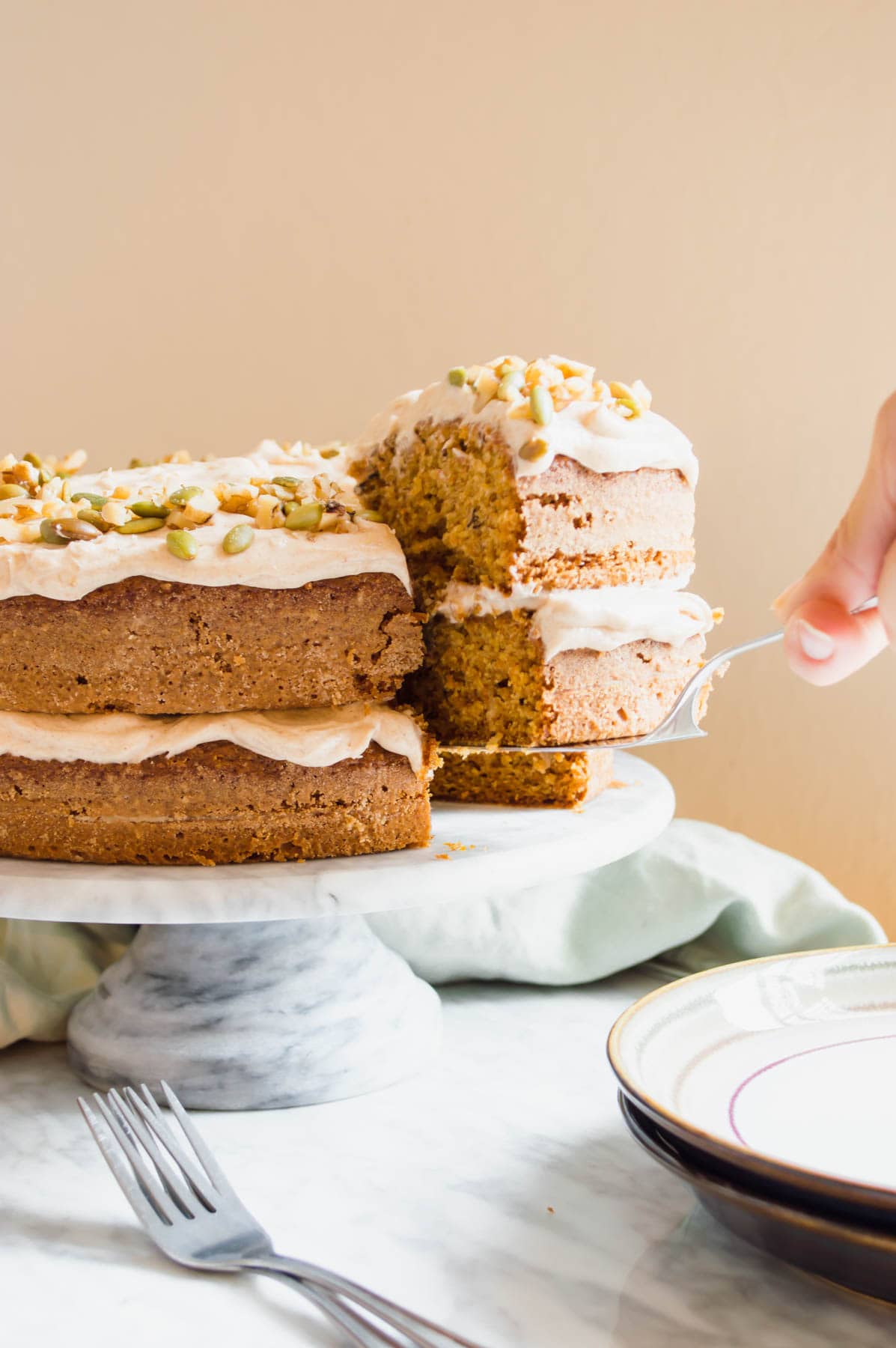 Serving slice of Carrot Cake with Chai Spiced Frosting.