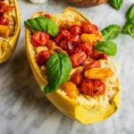 Spaghetti squash boats with blistered tomatoes and basil.
