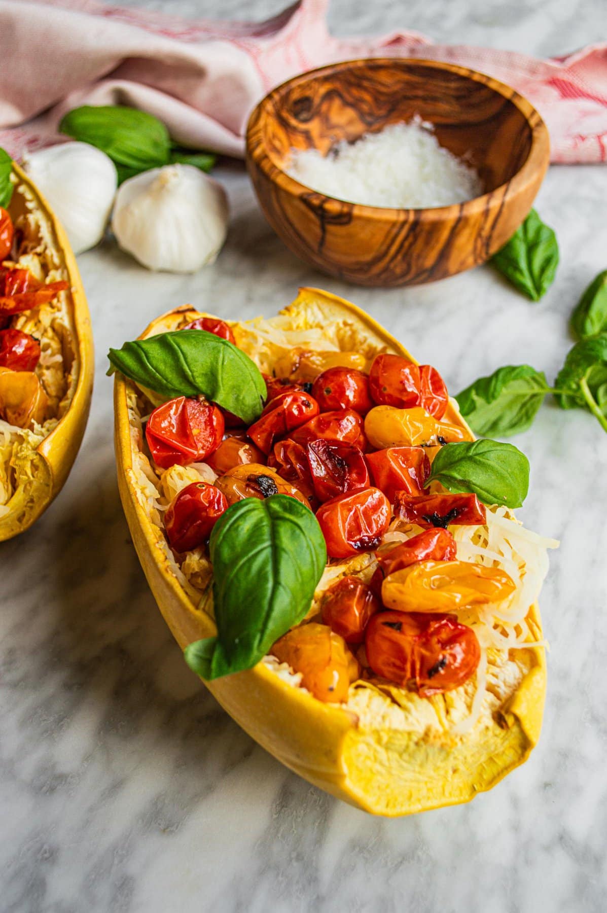 Spaghetti squash boats with blistered tomatoes and basil.