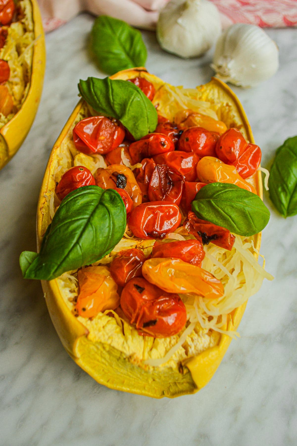 Stringy spaghetti boats with saucy fresh tomatoes and basil.