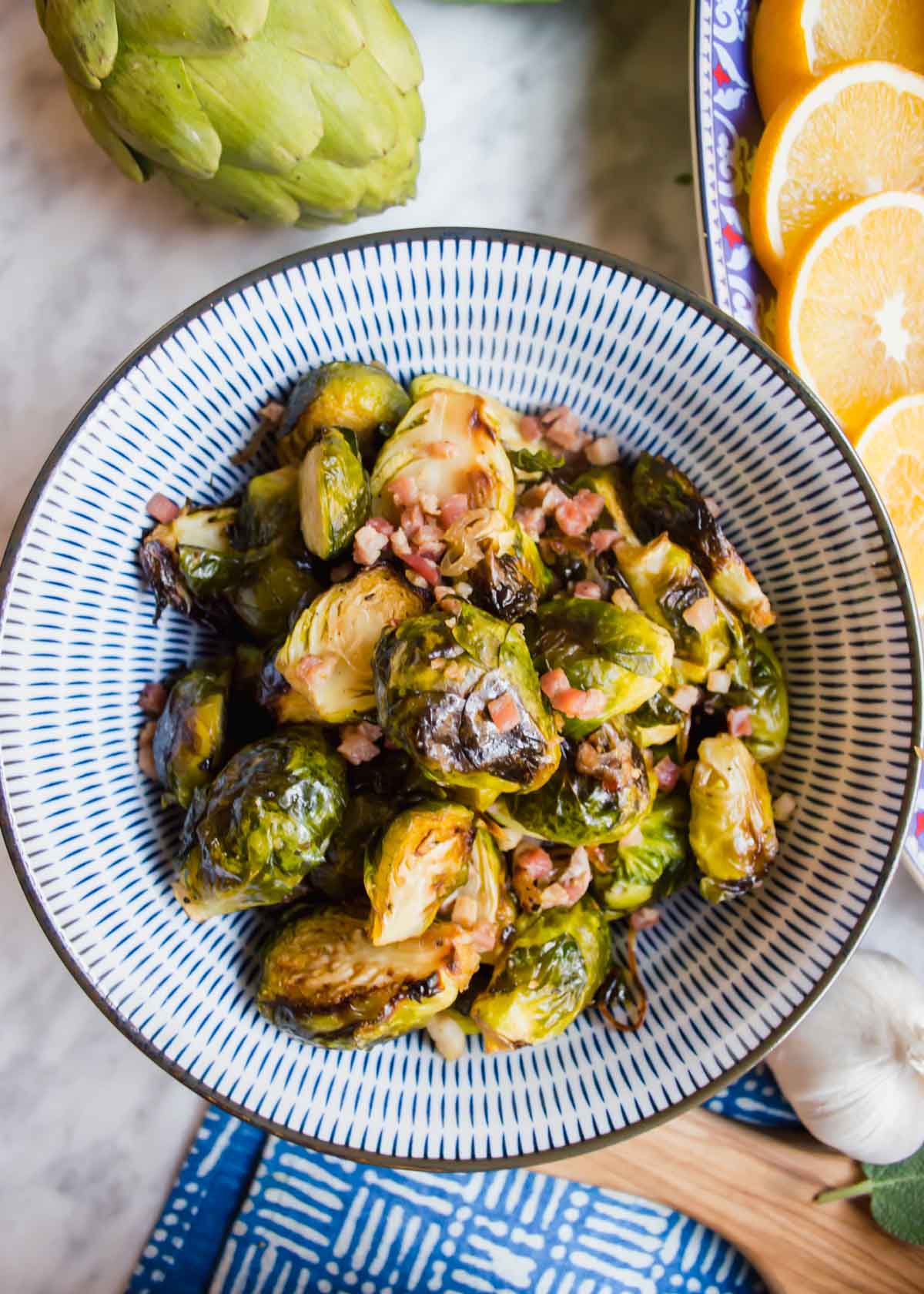 Maple Brussel Sprouts with Pancetta in bowl flatlay.