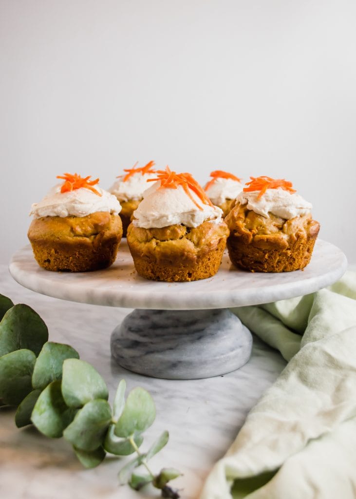 Peanut Butter and Carrot Pupcakes for dogs on a marble cakestand
