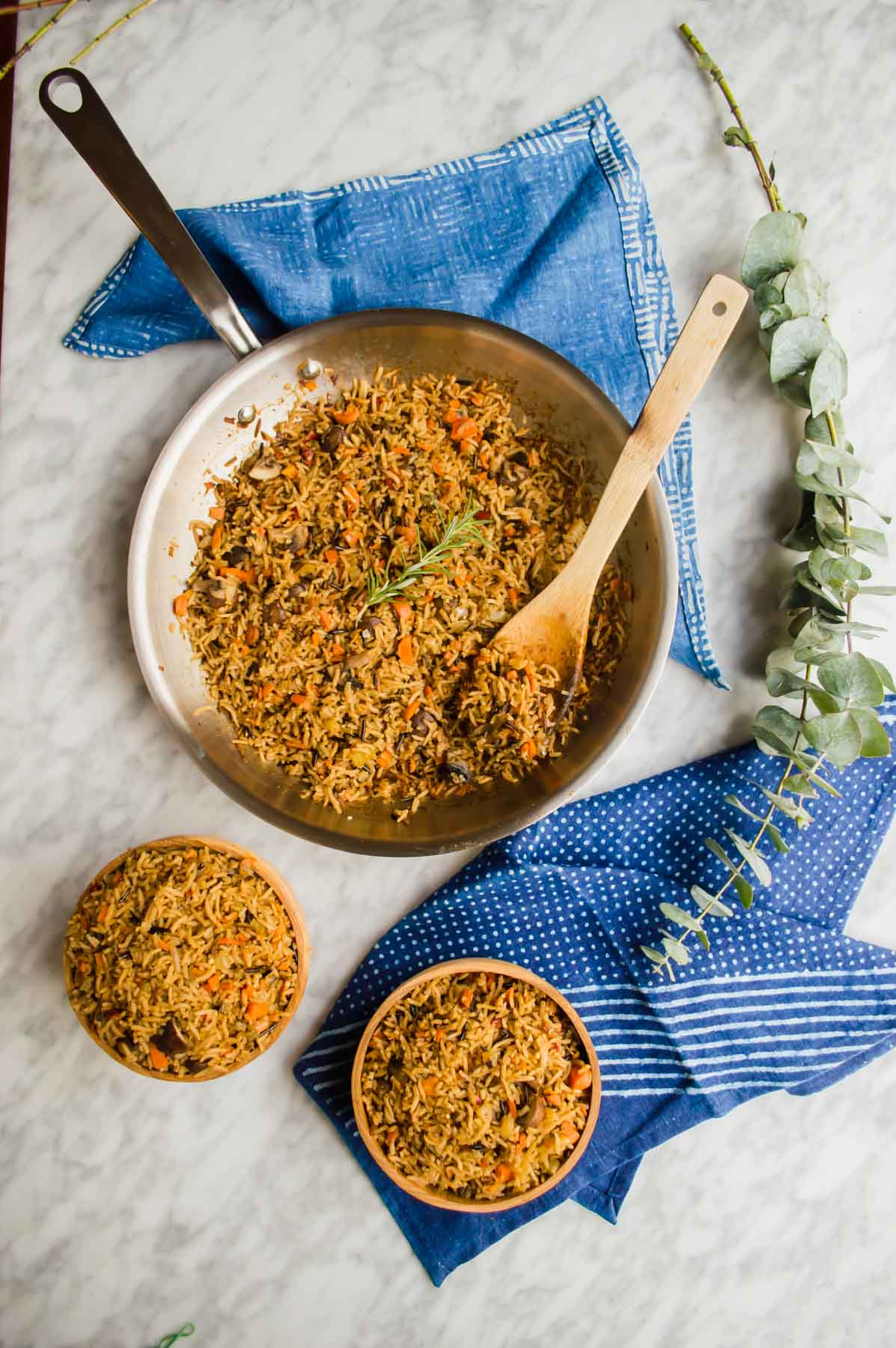 Vegetable Wild Rice in pan and bowls flatlay.