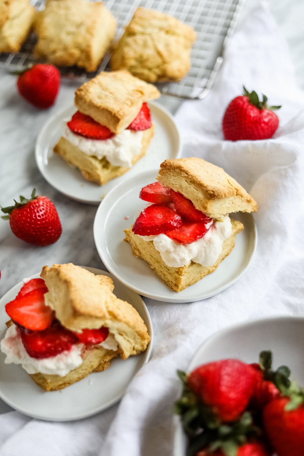 Easy strawberry shortcake on white plates.