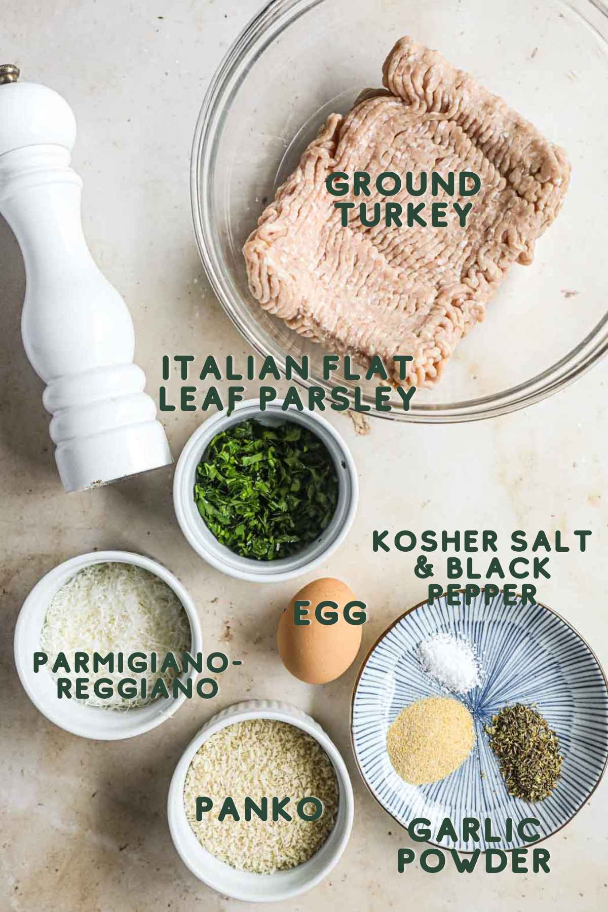 Ingredients to make ground turkey meatballs, ground turkey, italian flat leaf parsley, parmigiano-reggiano, egg, kosher salt, black pepper, panko, and garlic powder.