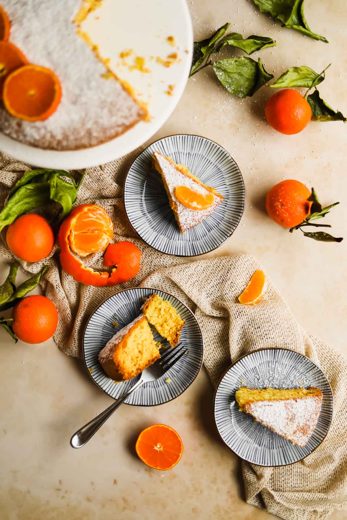 Clementine Olive Oil Cake slices on blue plates.
