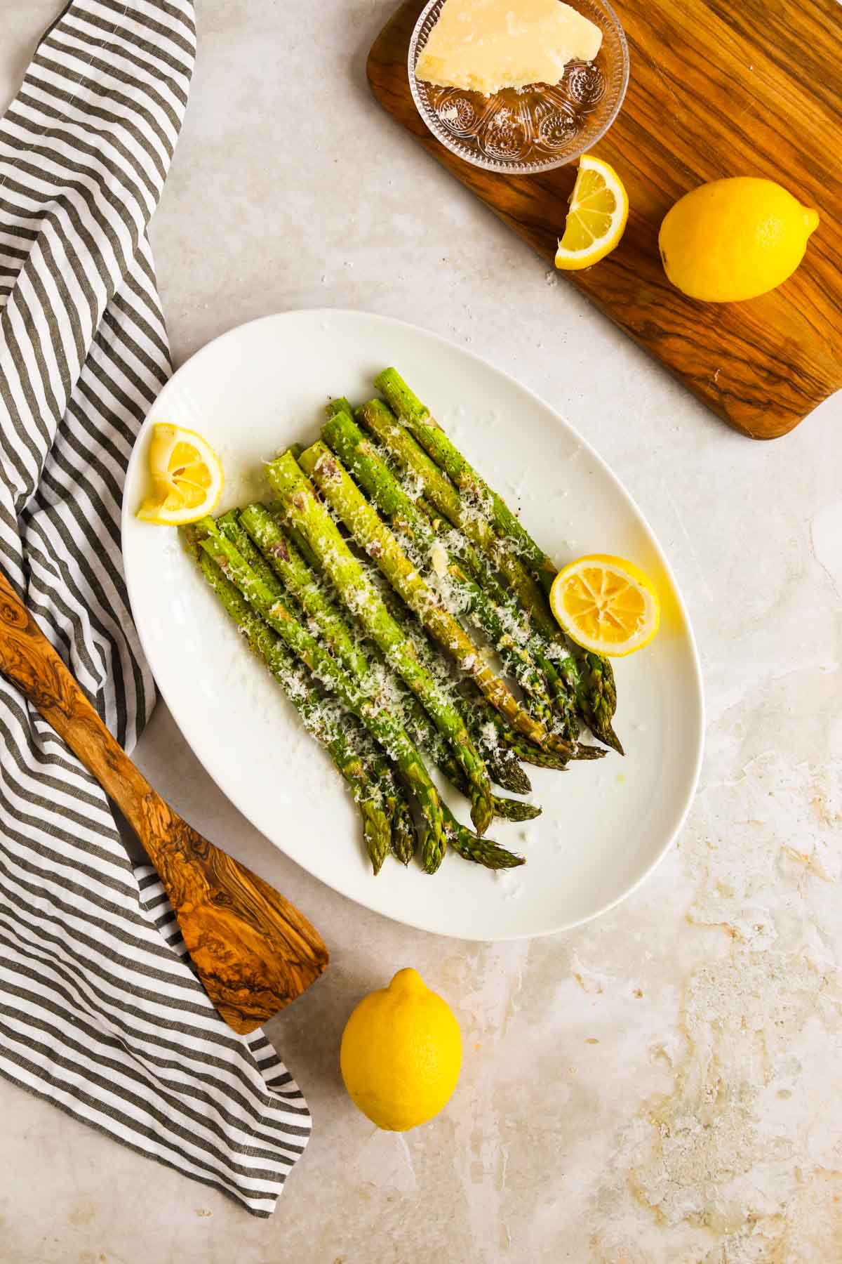 Roasted Asparagus with Lemon and Parmigiano-Reggiano on white Pottery Barn platter.