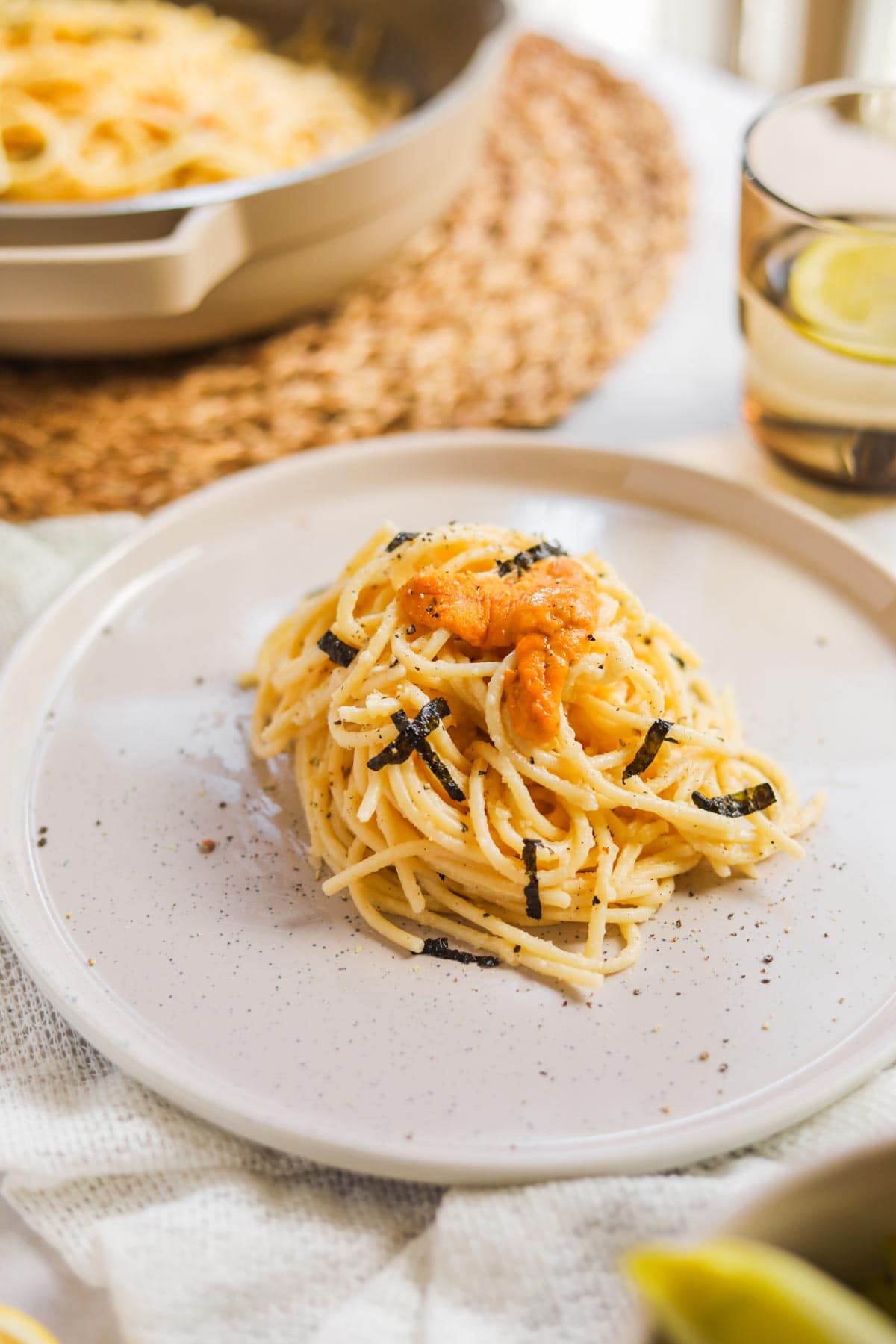 Uni pasta cacio e pepe on a plate with nori and sea urchin
