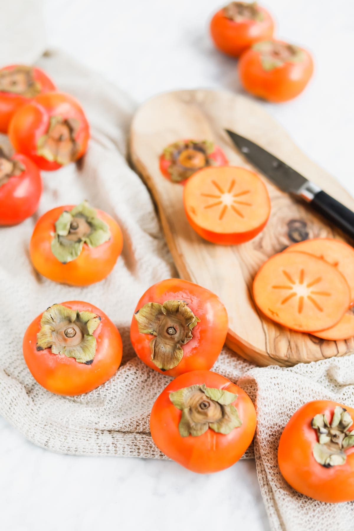 Chopped persimmons on cutting board.