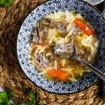 Italian beef soup (brodo di carne) in blue and white bowl.