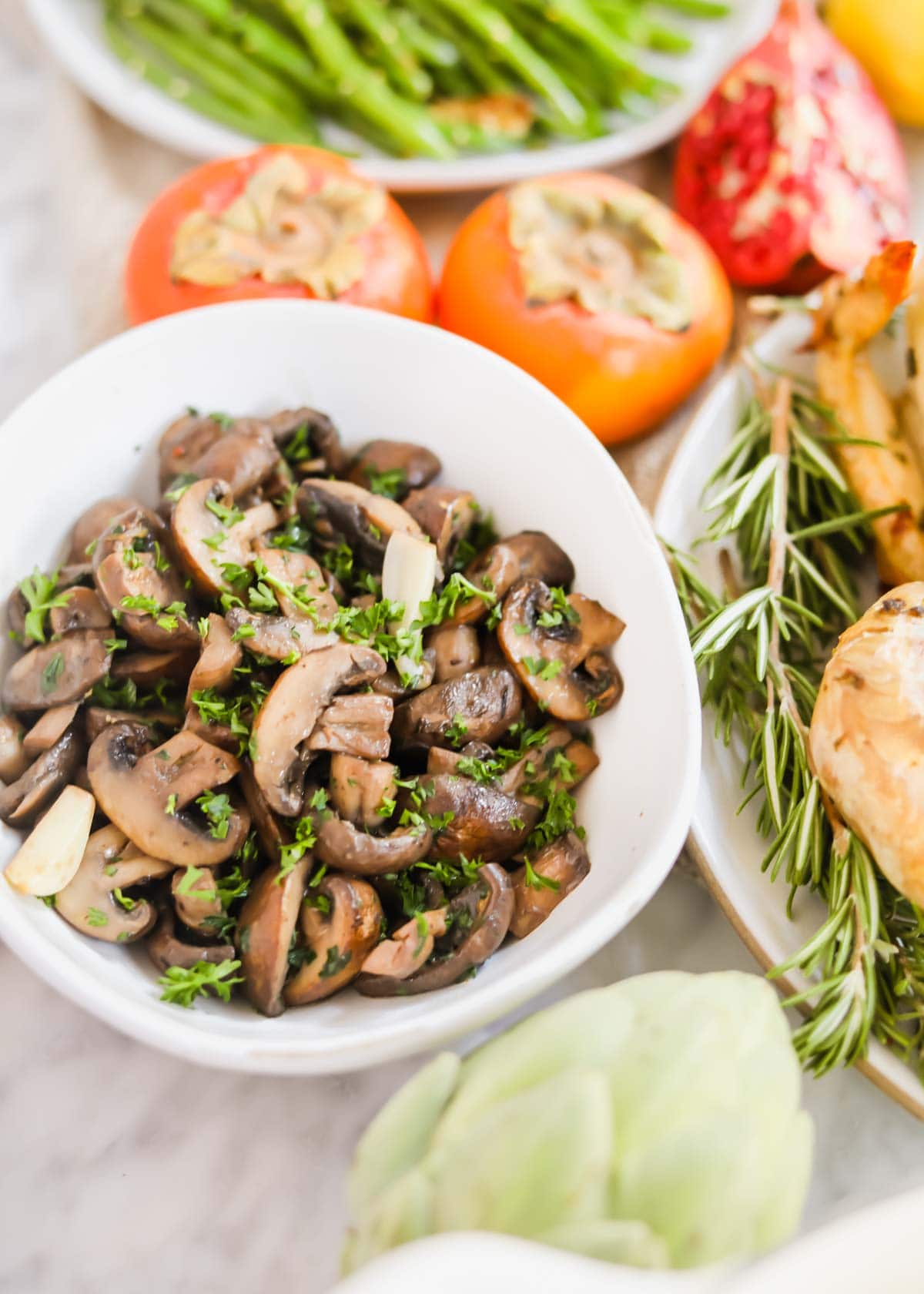 Sautéed mushrooms with White Wine in white bowl.