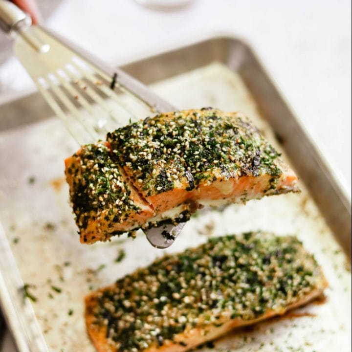 Furikake Salmon with Kewpie mayo on a sheet pan with a spatula.