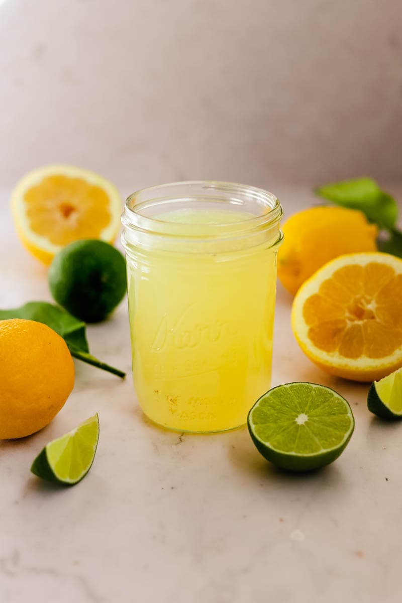 Homemade Sweet and Sour Drink Mix made with lemon and lime in a mason jar.