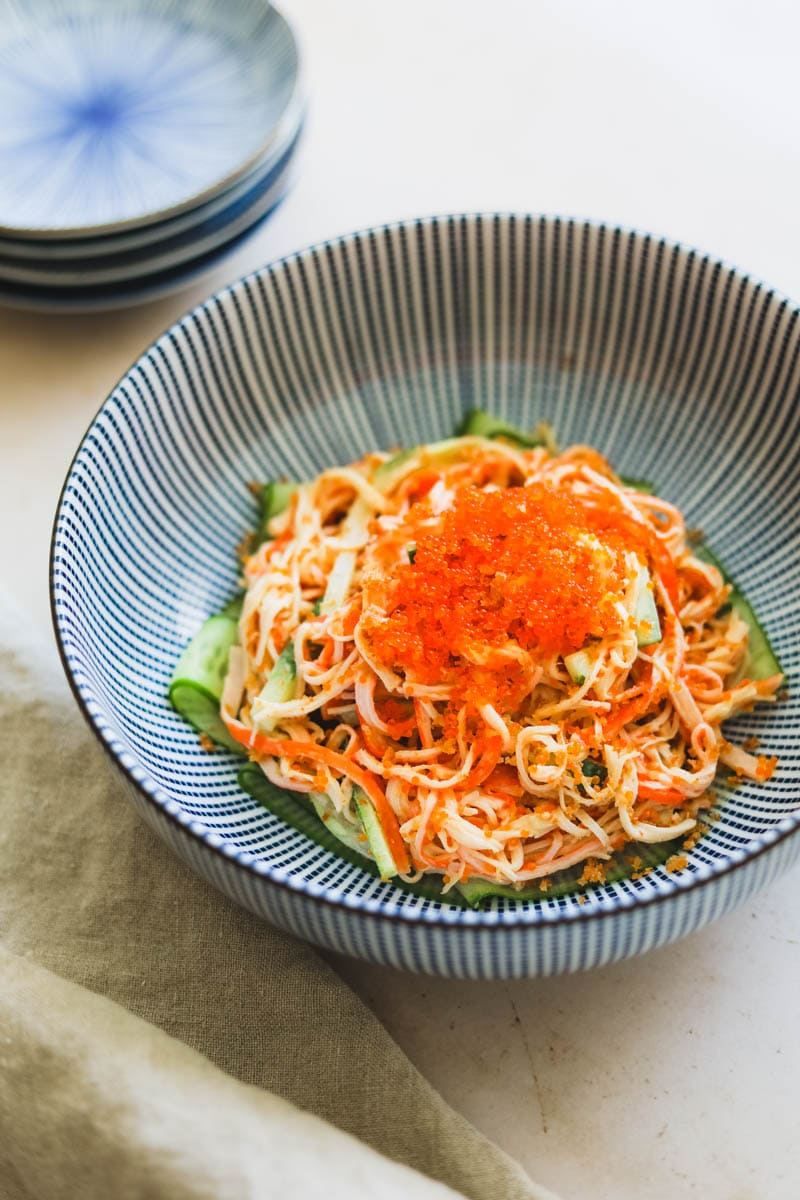 Spicy Kani Salad with tobiko and panko bread crumbs in a blue Japanese striped bowl
