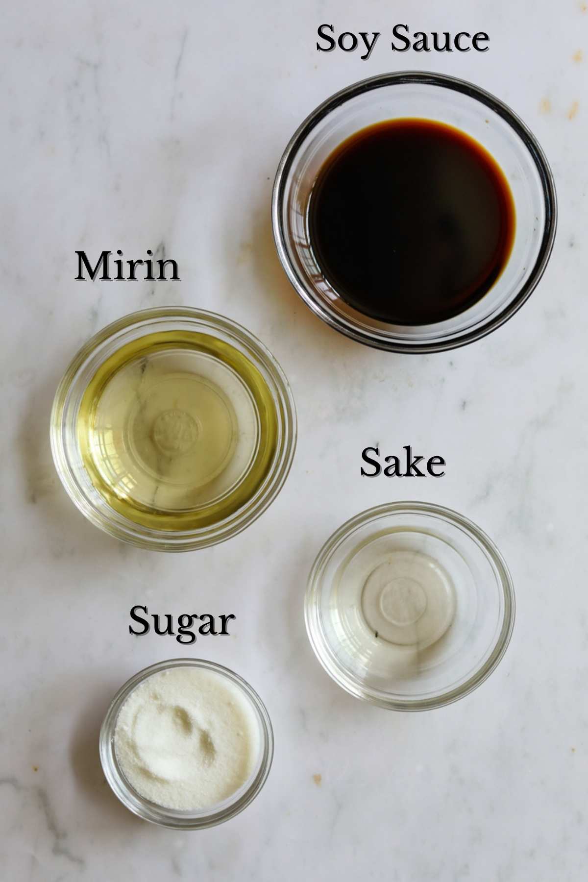Ingredients to make unagi sauce (mirin, sugar, sake, soy sauce).
