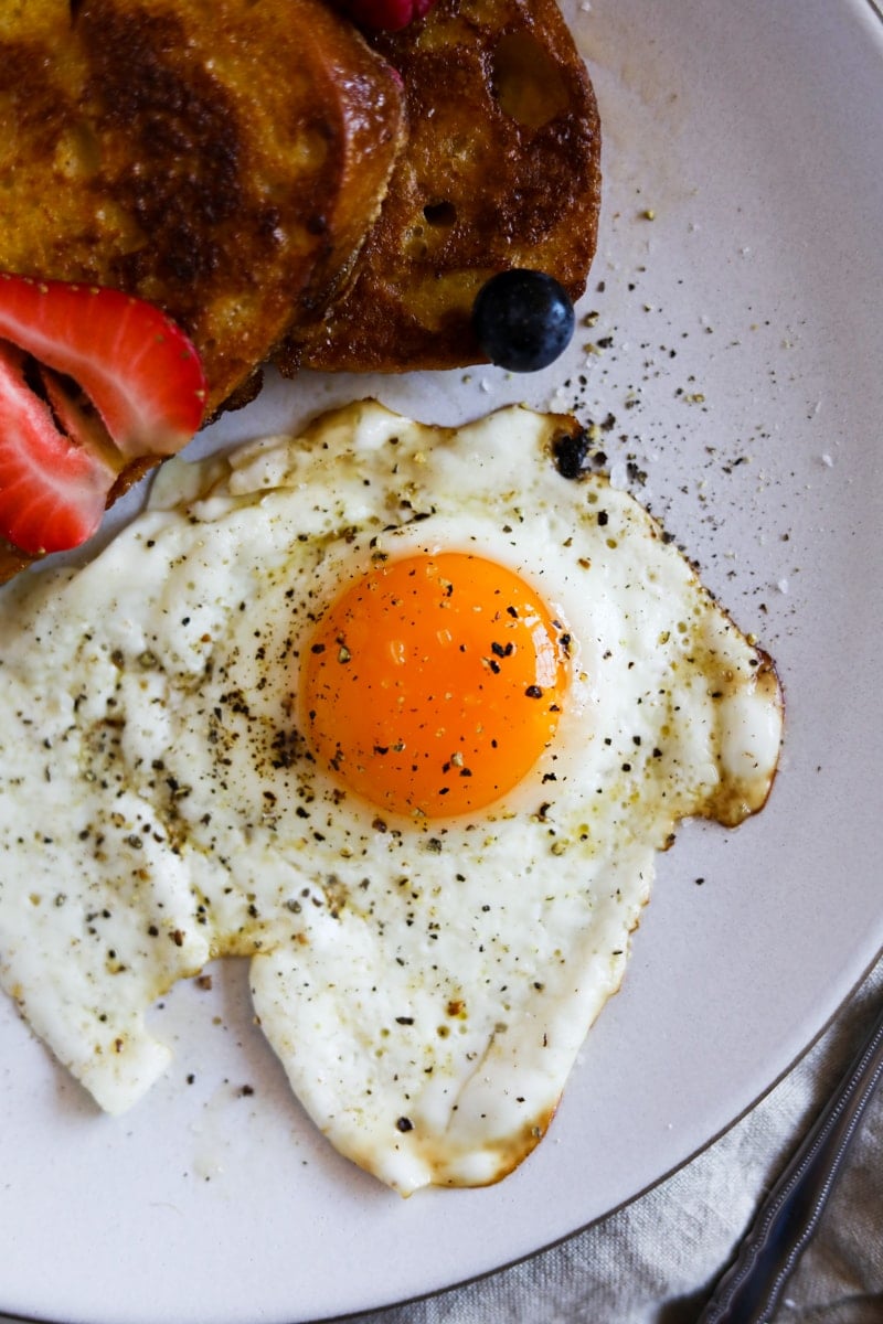 Perfectly fried eggs on a plate for breakfast.