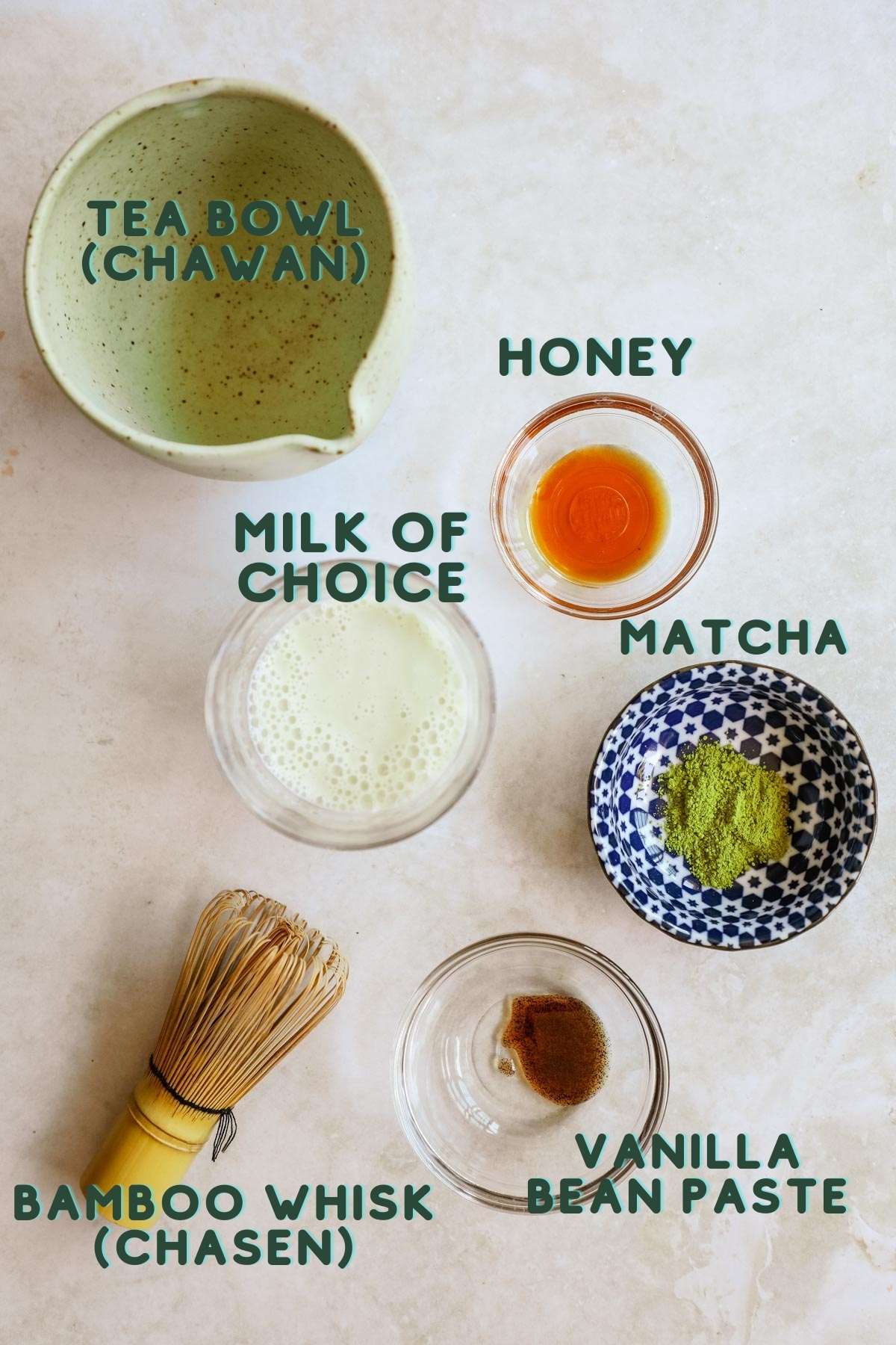 Ingredients to make a hot or iced vanilla matcha latte with honey.