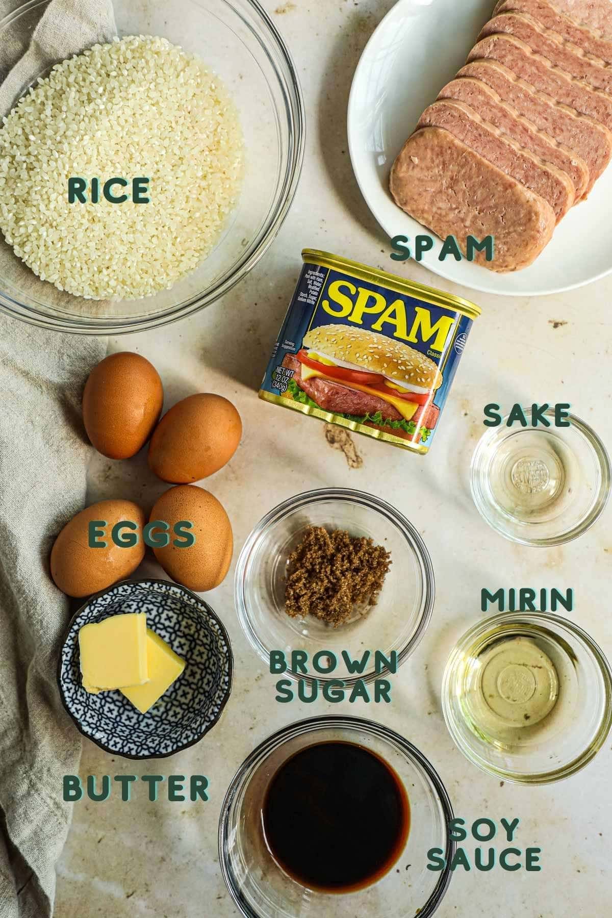 Ingredients to make fried SPAM, sunny side up eggs, and rice for breakfast.