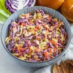 Healthy Greek Yogurt Coleslaw (with Napa and Red Cabbage) in a striped Japanese bowl.