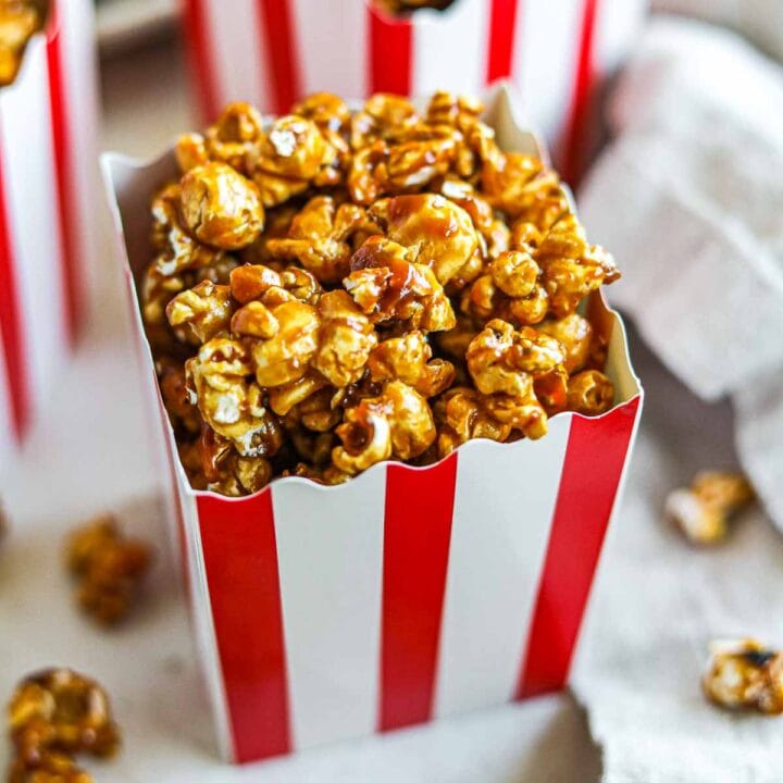 Miso caramel popcorn in small red and white striped movie popcorn boxes.