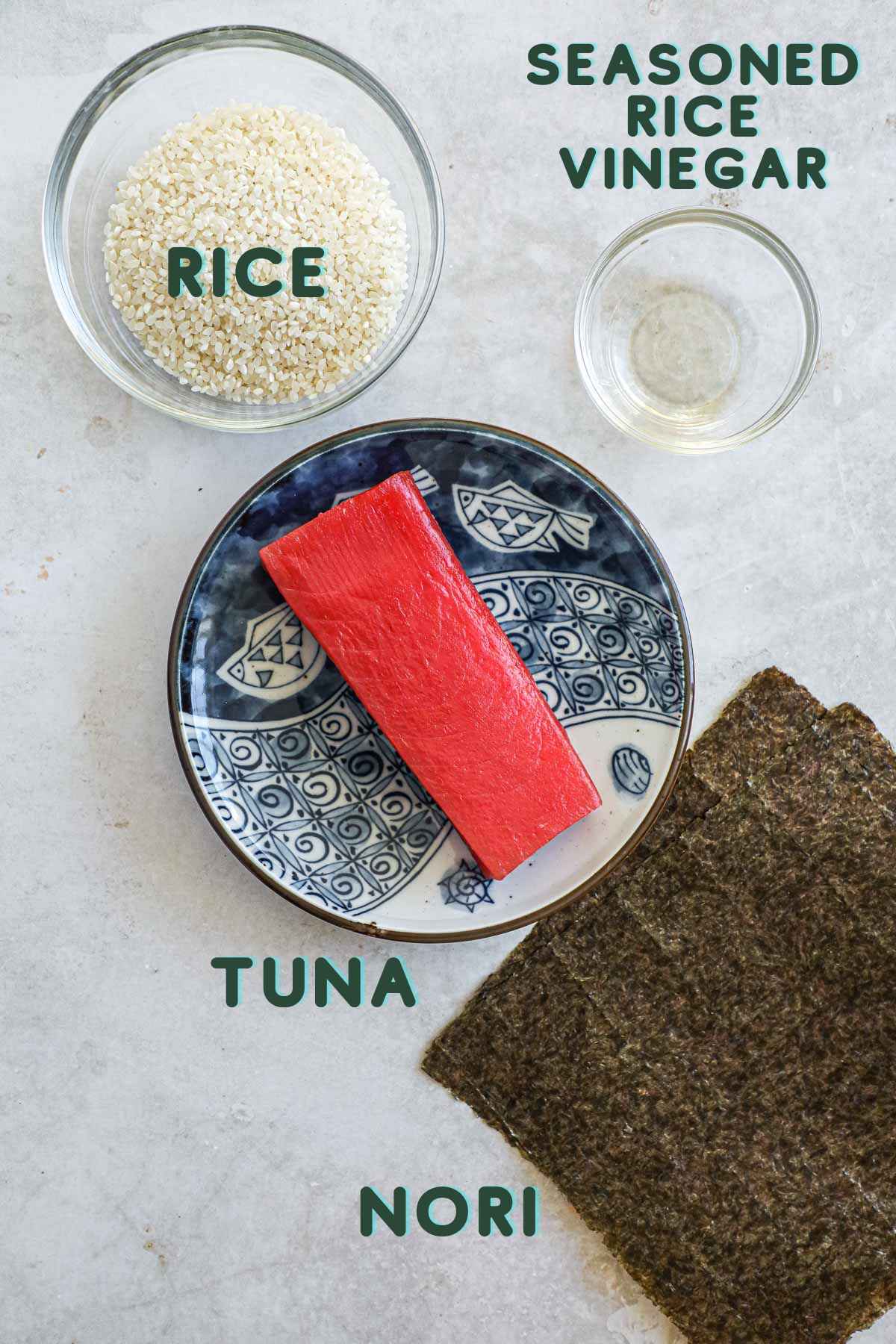 Ingredients for tekka maki, including fresh sushi-grade tuna, Japanese rice, seasoned rice vinegar, and nori.