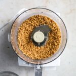 Hazelnut flour/meal made from toasted hazelnuts in a Cuisinart food processor.
