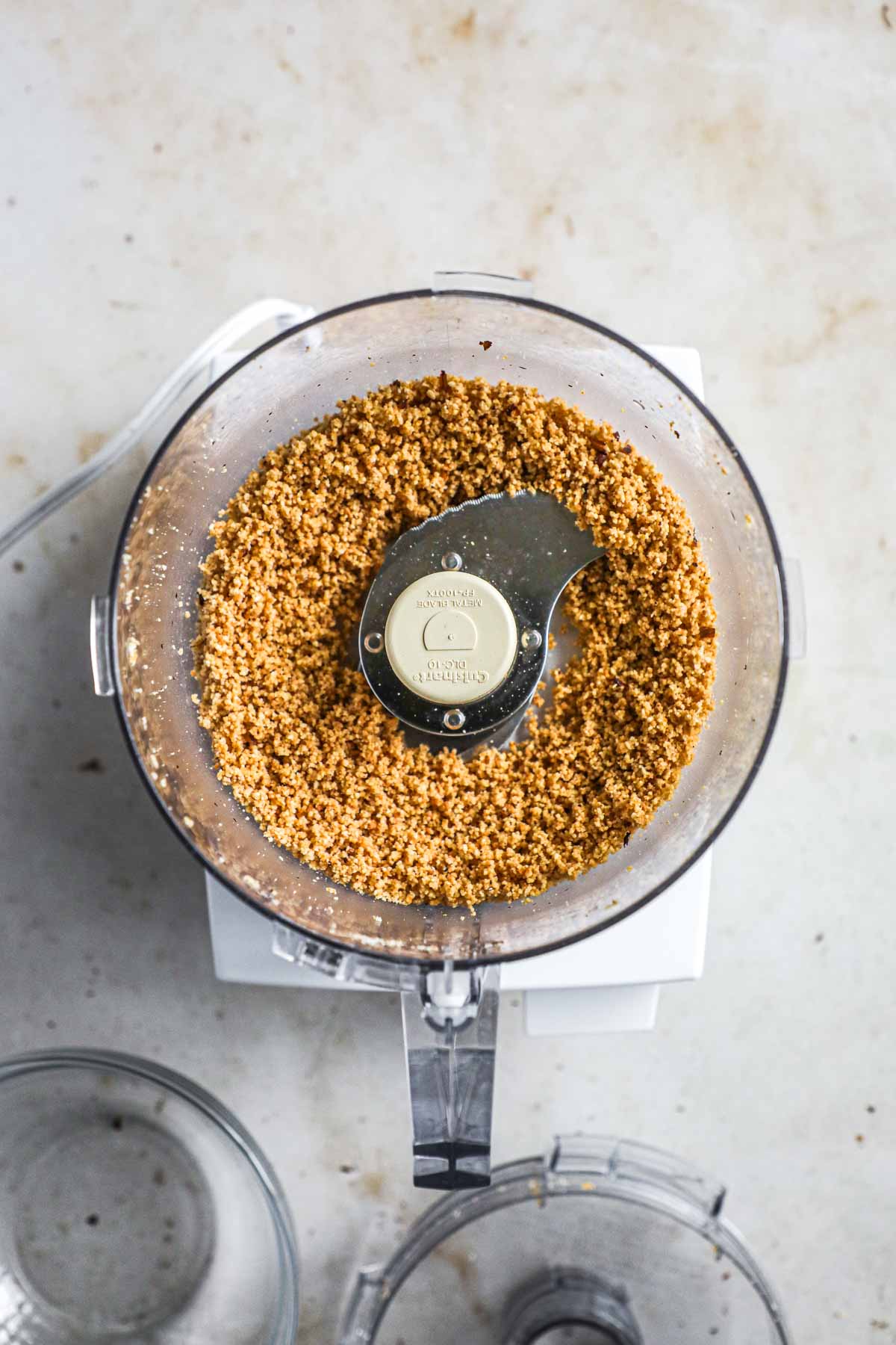 Hazelnut flour/meal made from toasted hazelnuts in a Cuisinart food processor.