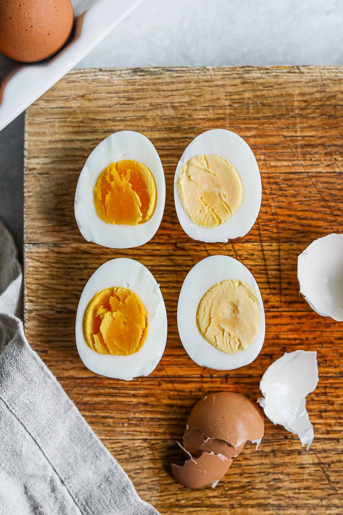 Sliced hard boiled eggs with orange soft yolks (9 minutes) and creamy yellow yolks (12 minutes). 