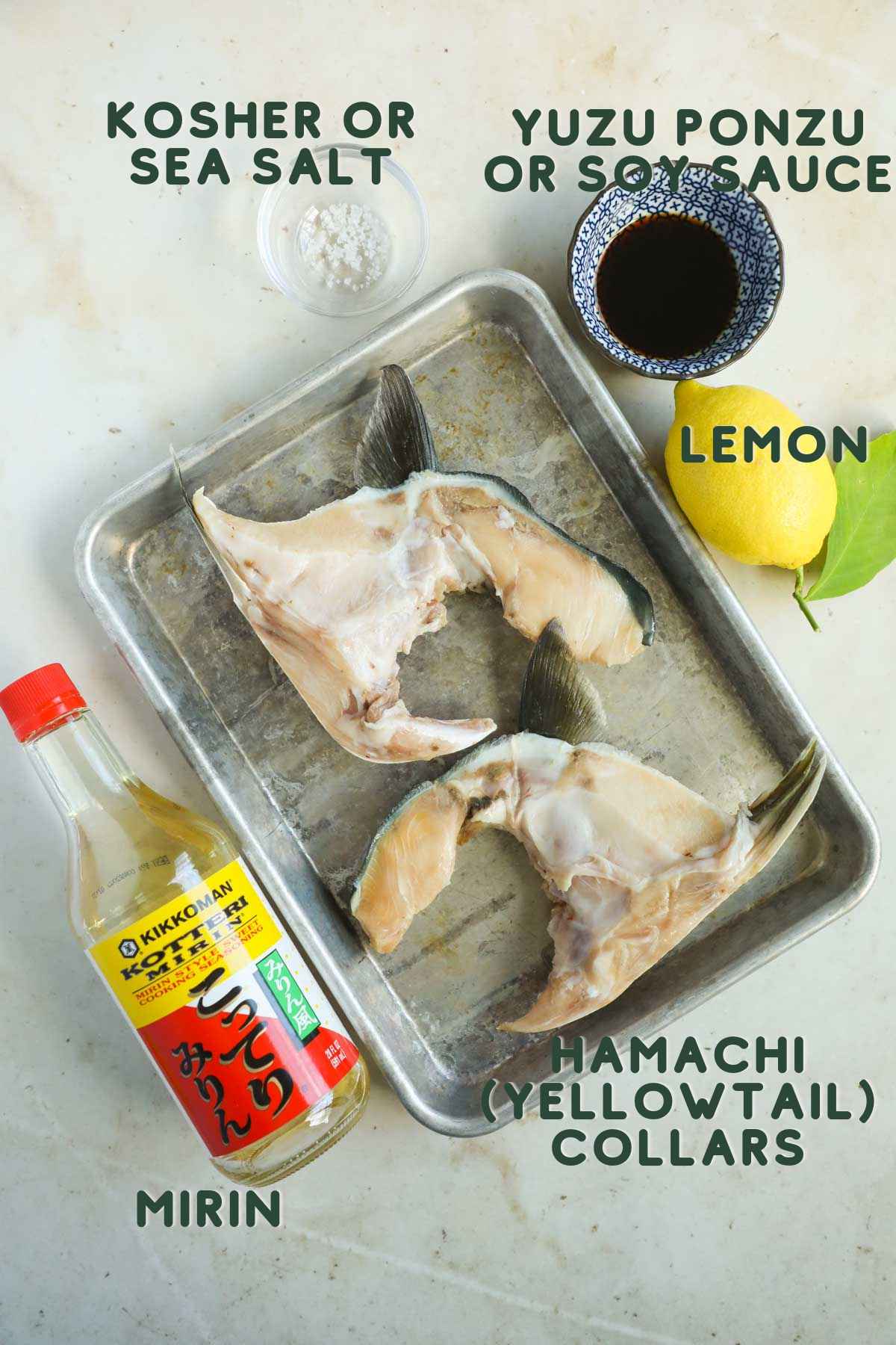 Ingredients to make broiled hamachi kama (yellowtail collar), including hamachi collar, mirin, lemon, yuzu ponzu or soy sauce, sea salt, and mirin.
