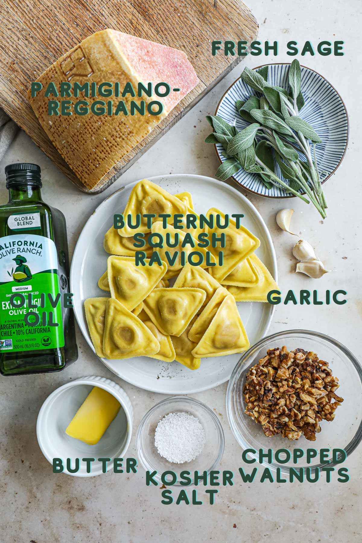 Ingredients to make butternut squash ravioli in a browned butter sauce, including butternut squash ravioli, olive oil, fresh sage leaves, butter, kosher salt, chopped walnuts, garlic, and parmigiano reggiano.