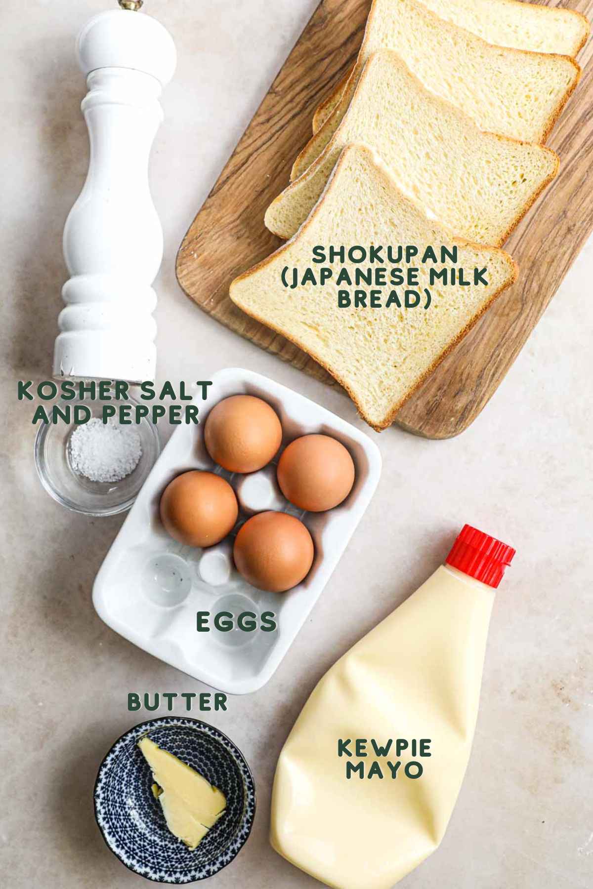 Ingredients to make tamago sando (Japanese egg salad sandwich), including shokupan, salt and pepper, pasture-raised eggs, Kewpie mayo, and butter.