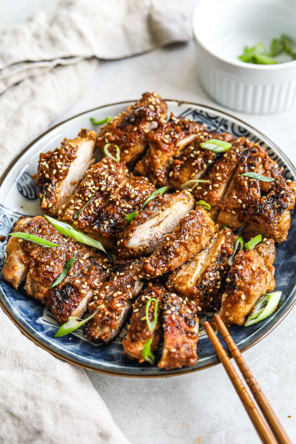 Juicy jidori chicken thighs simmered in a miso, soy sauce, sake sauce and topped with sesame seeds and scallions.