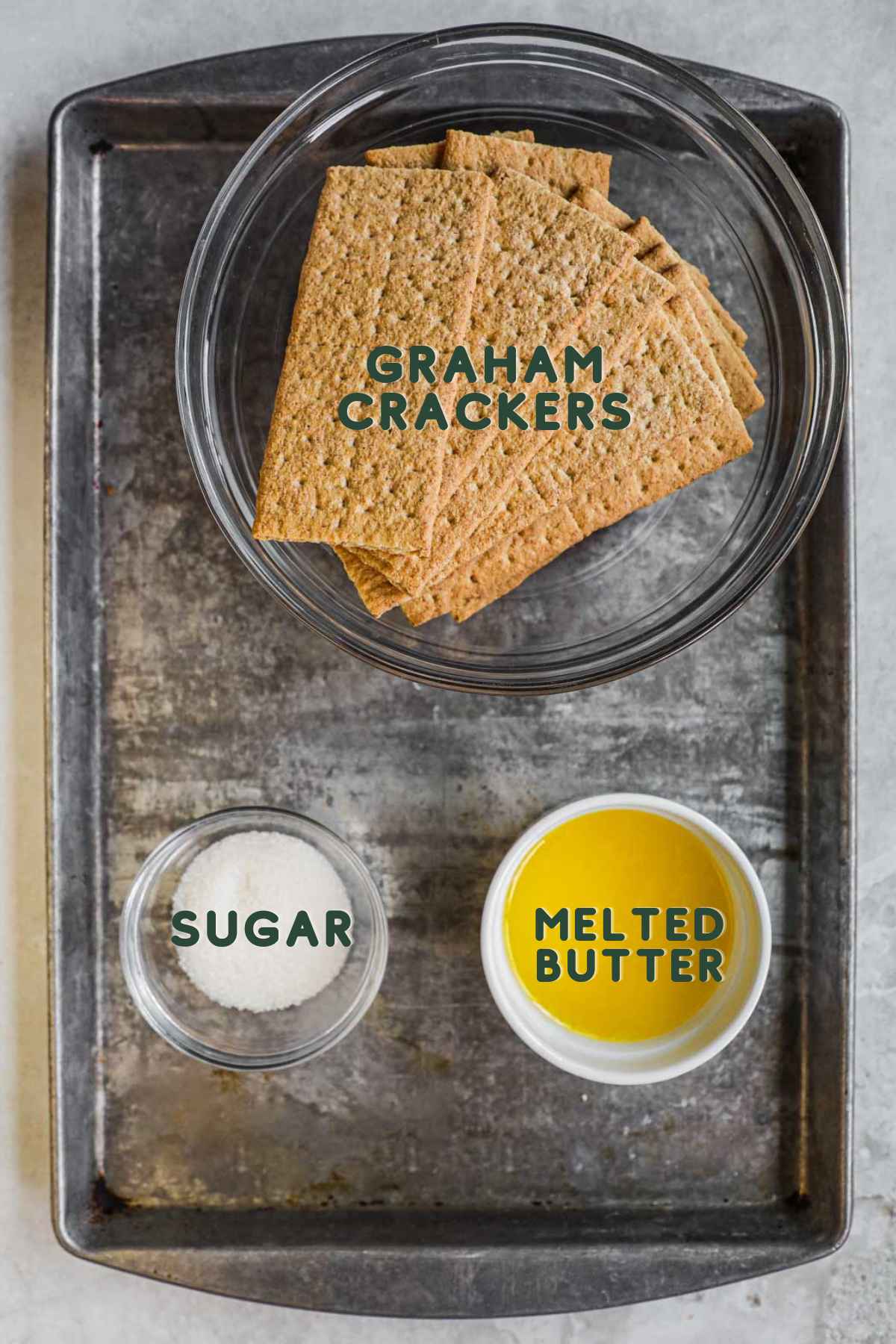 Ingredients to make easy graham cracker crust, graham crackers, sugar, melted butter, and salt.