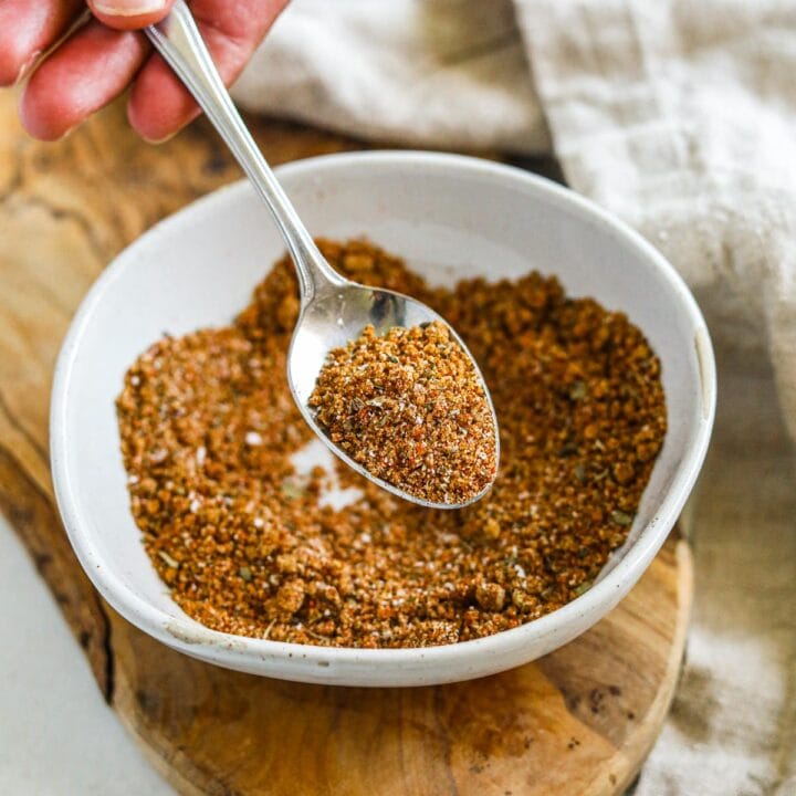 Spoon holding brown sugar dry rub for chicken wings, ribs, and more.
