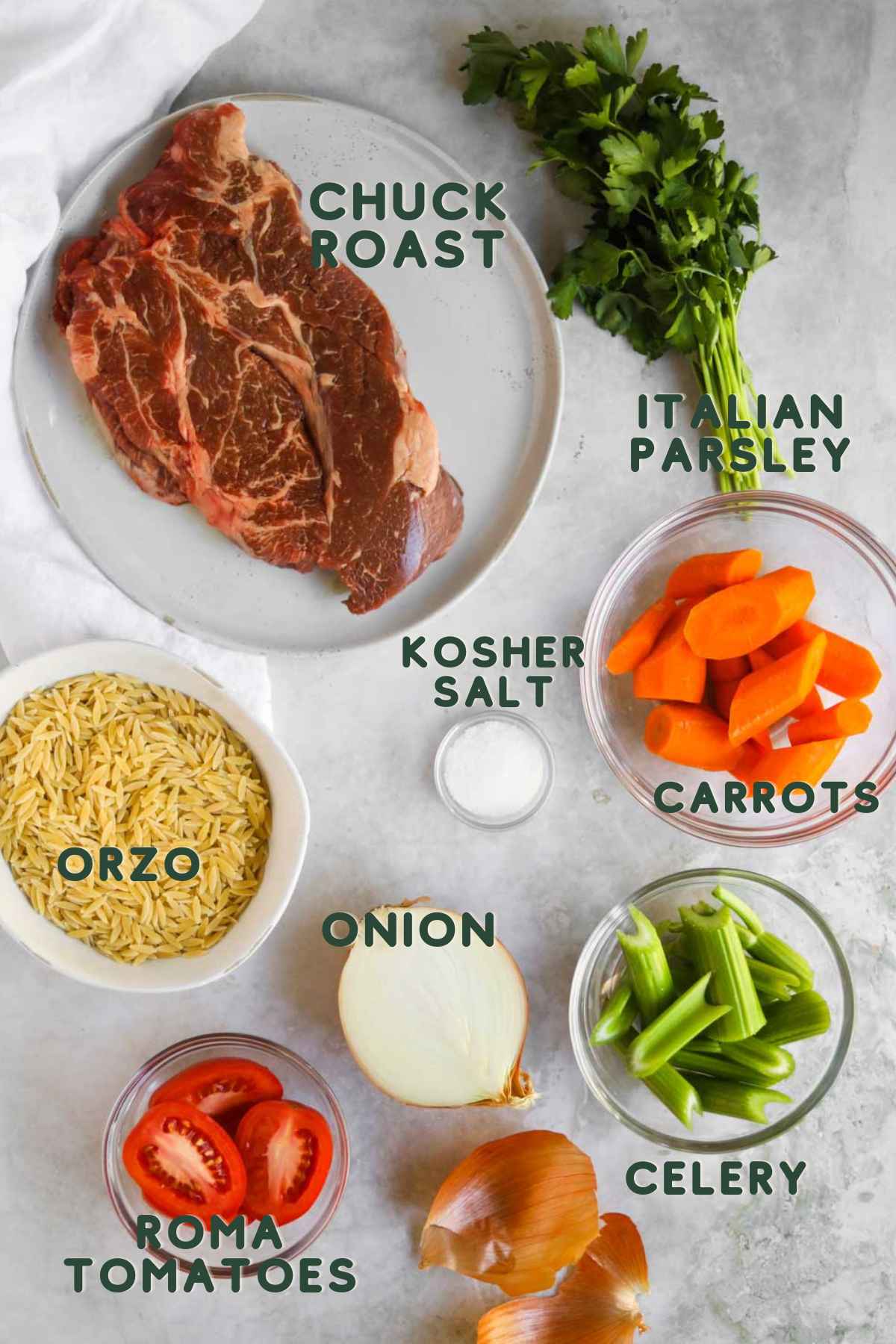 Ingredients to make Italian beef soup (brodo di carne), chuck roast, carrots, celery, onion, Italian parsley, roma tomatoes, kosher salt, orzo.
