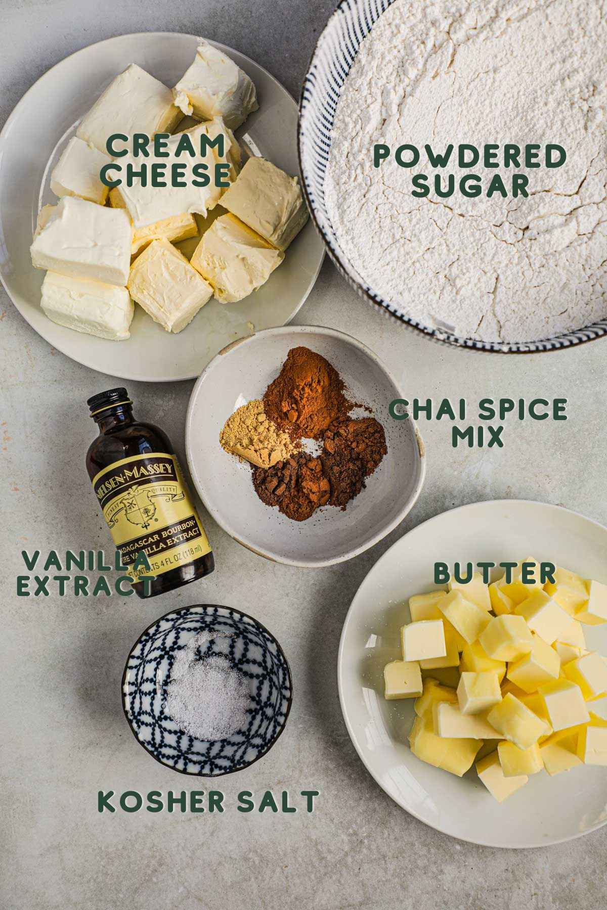 Ingredients for chai cream cheese frosting, chai spice mix, cream cheese, butter, vanilla, salt, powdered sugar.