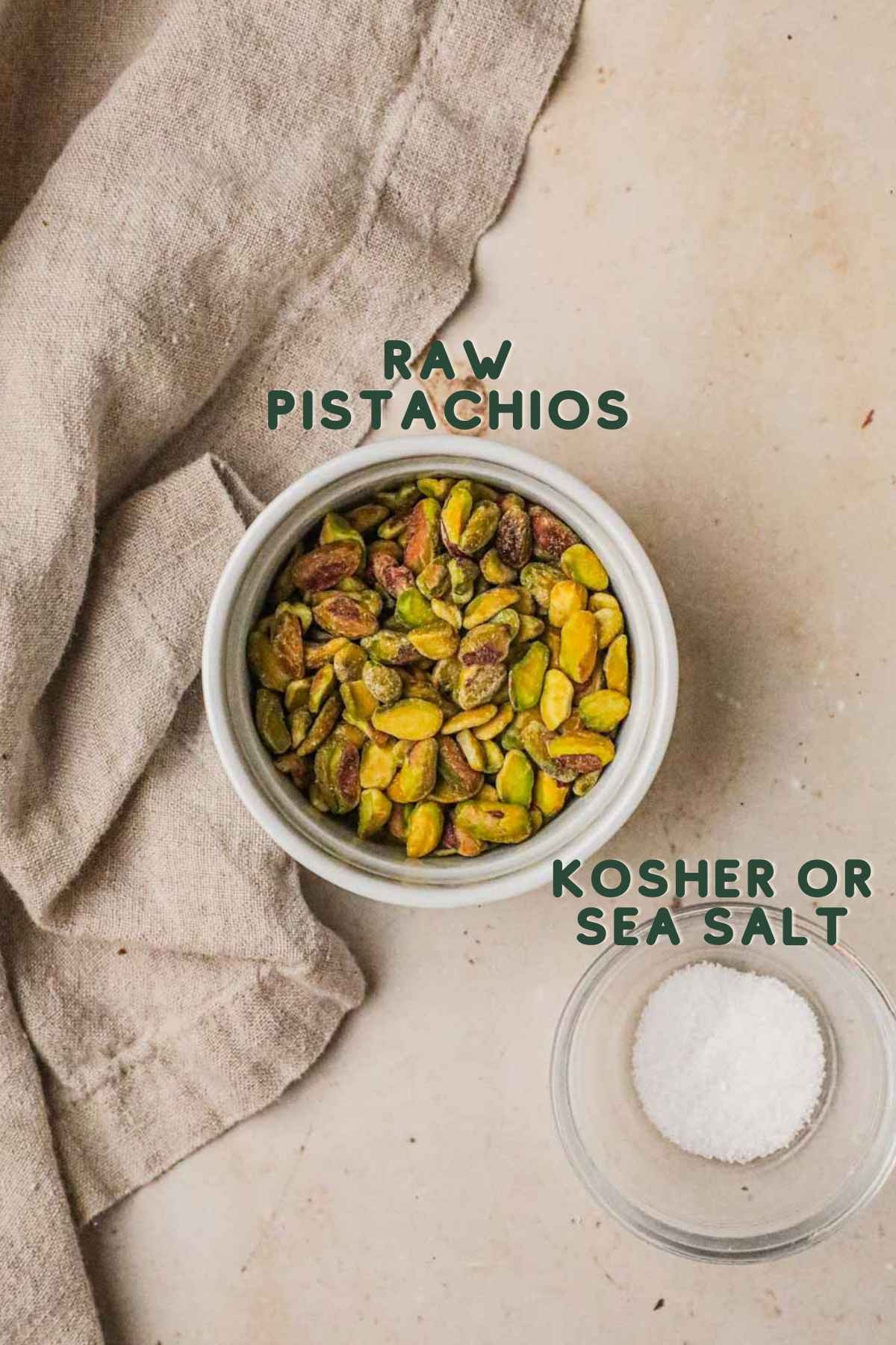 Ingredients to make roasted pistachios, raw shelled pistachios and sea salt or kosher salt.