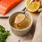 Honey garlic dijonnaise made with whole grain mustard in a ramekin for sandwiches, chicken, fish, and more.