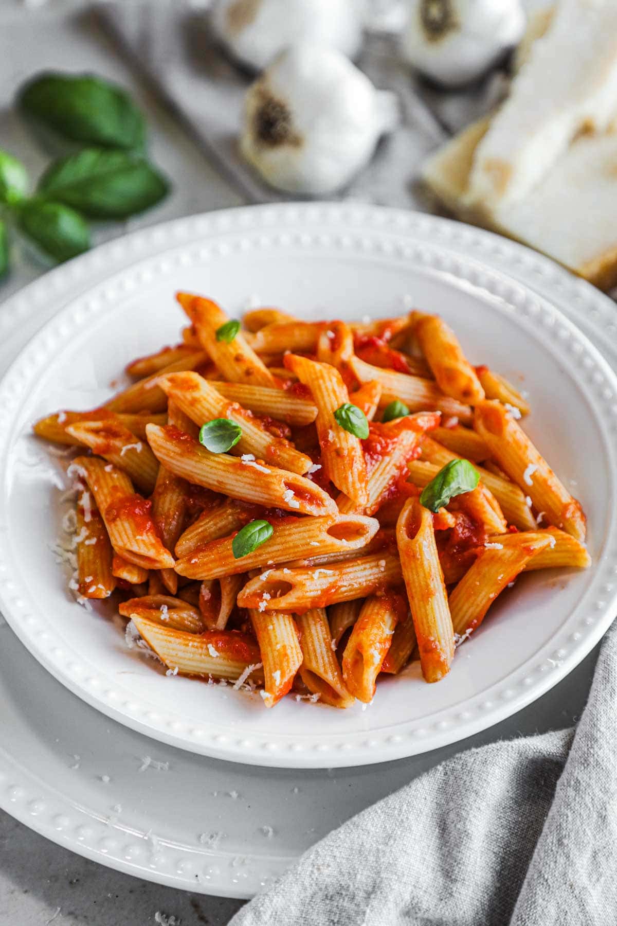 Authentic penne pomodoro made with San Marzano tomatoes and topped with parmigiano-reggiano.