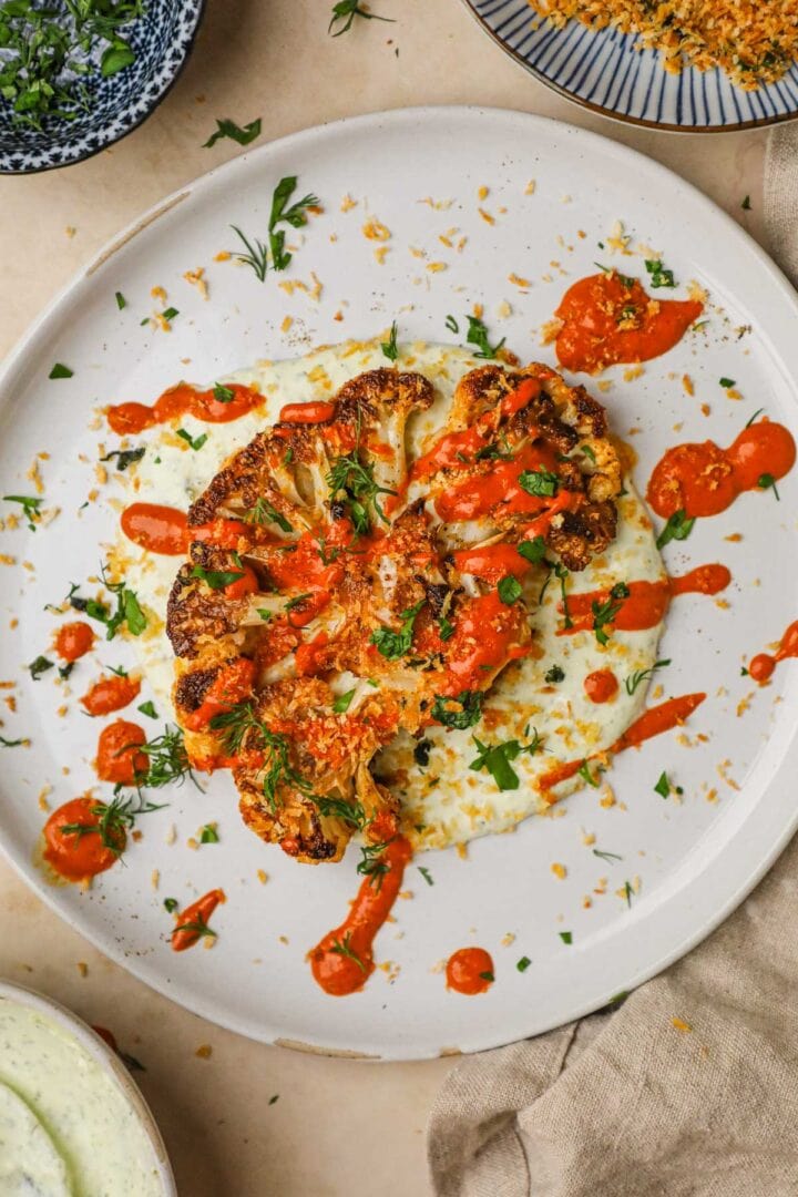 Cauliflower Steaks with Harissa Tahini Sauce • The Heirloom Pantry