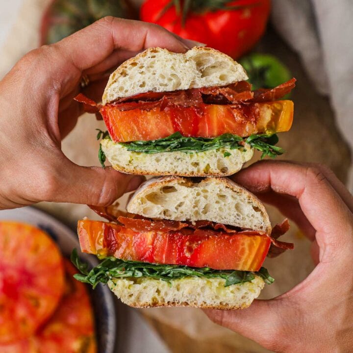 Italian BLT sandwich with heirloom tomatoes, crispy prosciutto, arugula, and garlic aioli on ciabatta.