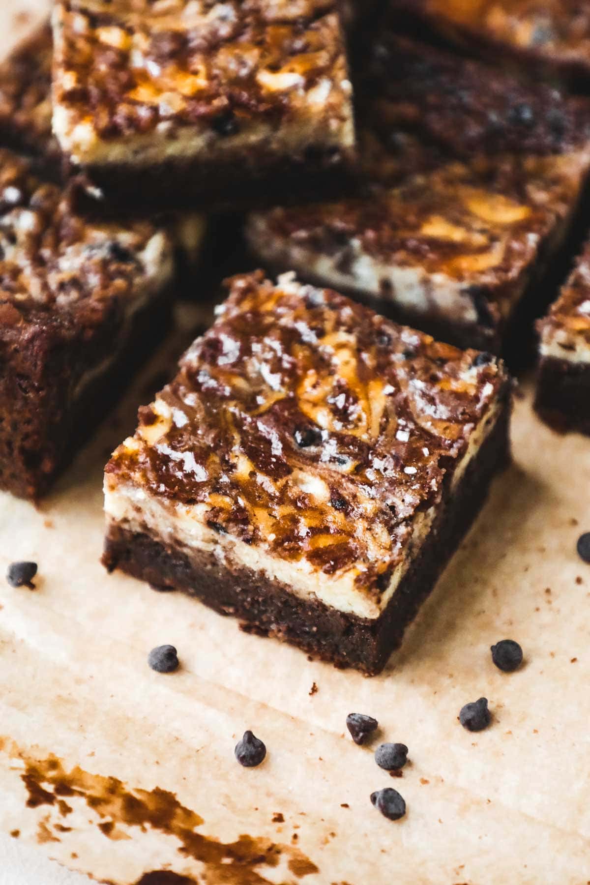 Brown butter brownies with a layer of cream cheese and swirled brownie batter and tiny chocolate chips.