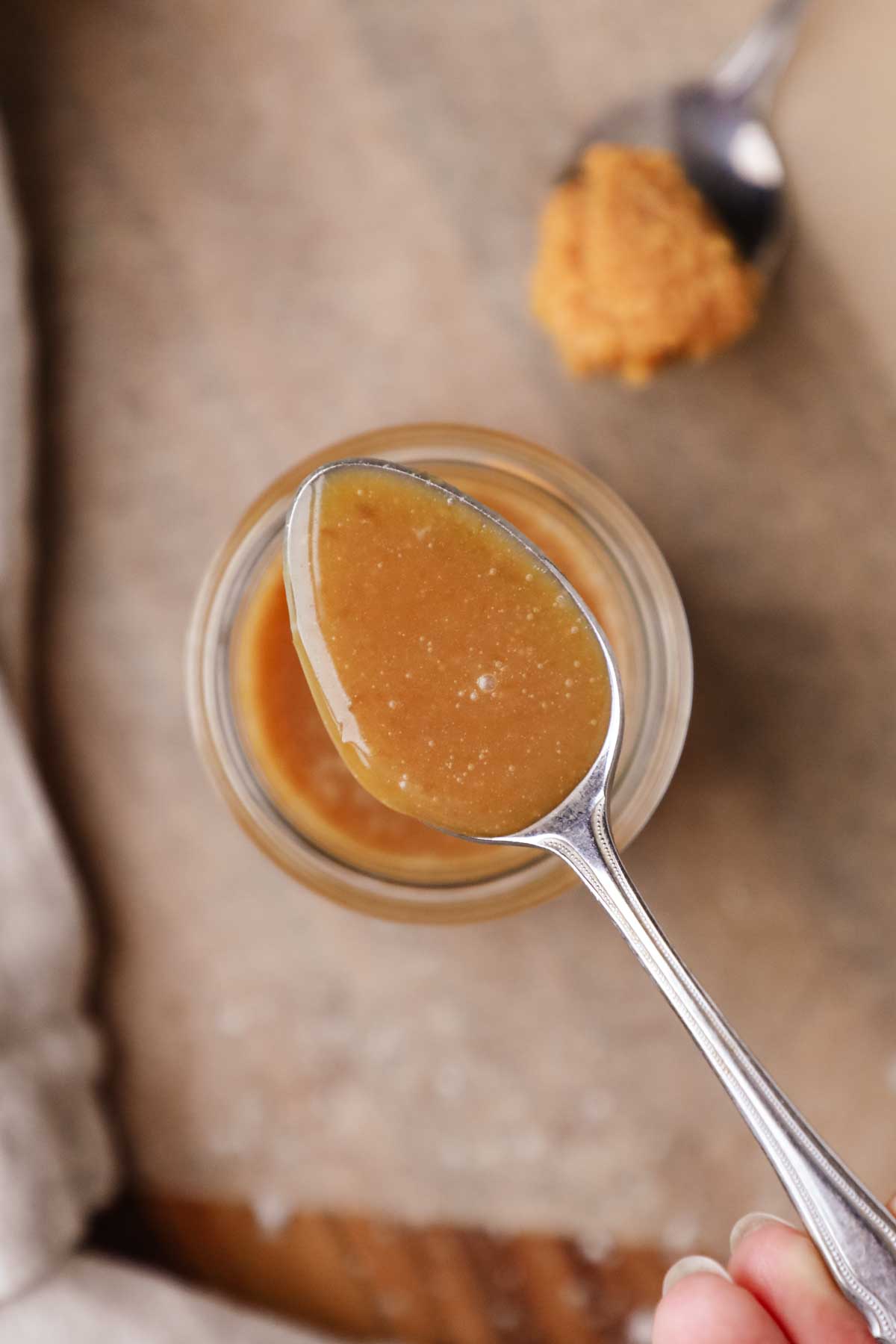 Homemade caramel sauce made with maple syrup and flavored with white miso paste for an umami-packed dessert topping.