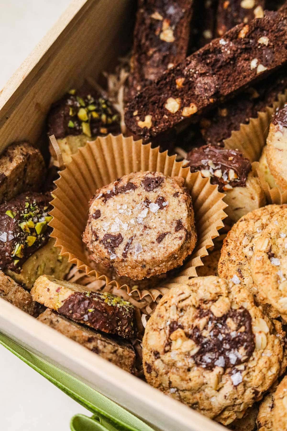 Brown butter chocolate chunk shortbread with Maldon flaky sea salt in a holiday cookie box.