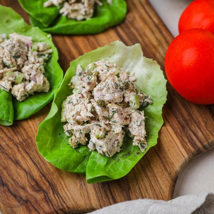 Tuna salad lettuce wrap cups with capers, dill, kewpie mayo, and dijon mustard butter or romaine lettuce cups.