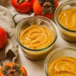 Homemade cinnamon persimmon curd in weck jars, made for spreading on toast, biscuits, waffles, and more, or drizzled on ice cream, yogurt, and more.