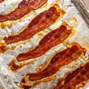 No-splatter easy oven-baked bacon on an aluminum foil-lined sheet pan.