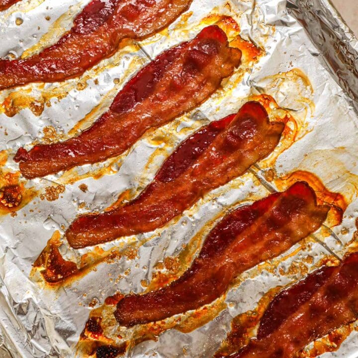 No-splatter easy oven-baked bacon on an aluminum foil-lined sheet pan.